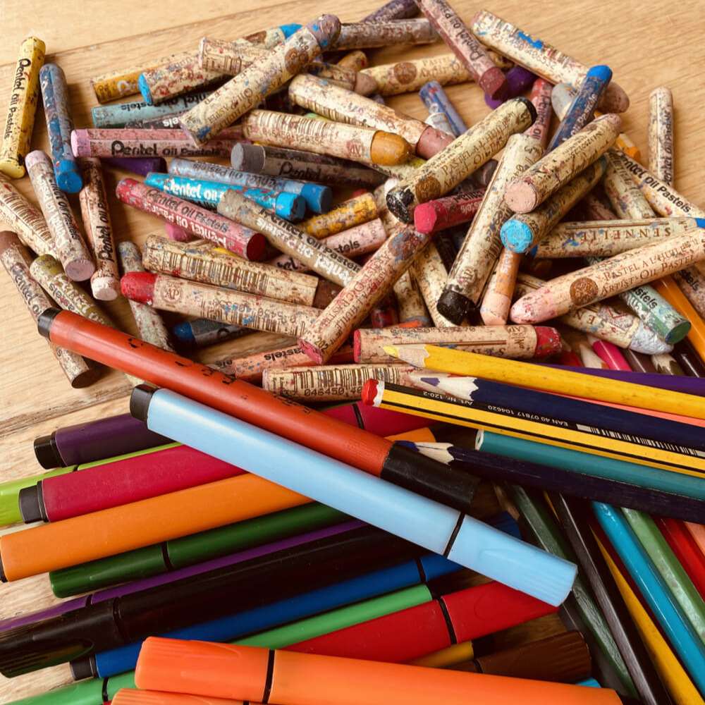 A vibrant assortment of crayons, pencils, and pens.